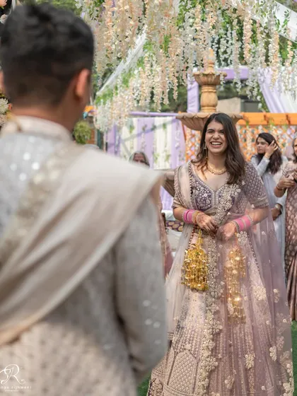 The bride's first look at her groom during their intimate Delhi wedding. A moment filled with so much love and excitement.