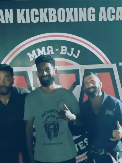 Pictured with the coaches from American Kickboxing Academy after my win. Respect is a core part of martial arts.