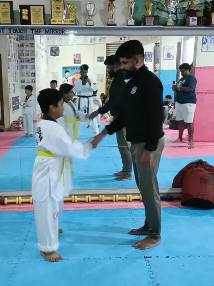 A handshake for a new yellow belt.