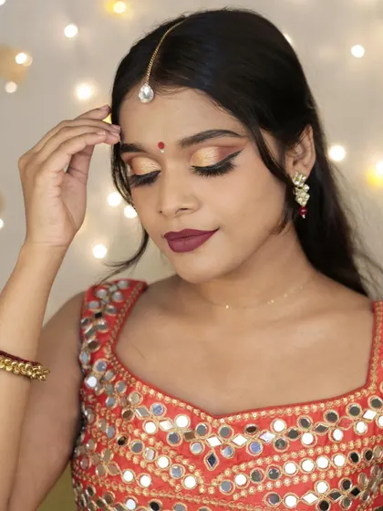 Embracing the festive spirit with a gold cut-crease look for an Amazon Fashion shoot. This makeup is perfect for traditional wear and celebratory occasions.