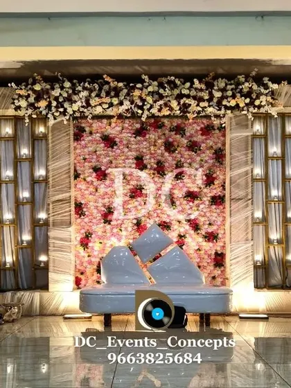 Another view of the elegant Sangeet decor, showing the beautiful texture of the flower wall and the soft glow from the integrated lighting.