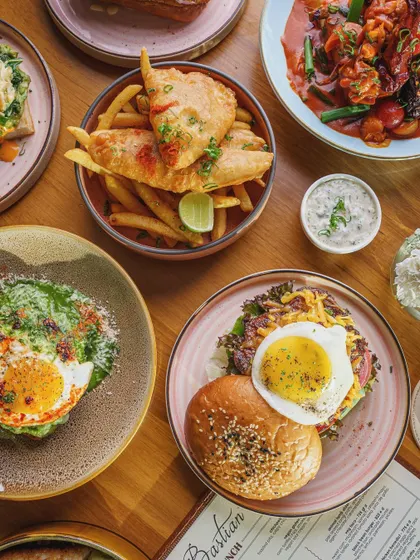 A brunch spread at Bastian, featuring a variety of dishes. This top-down shot captures the abundance and vibrancy of a weekend brunch, making it an aspirational image for customers.
