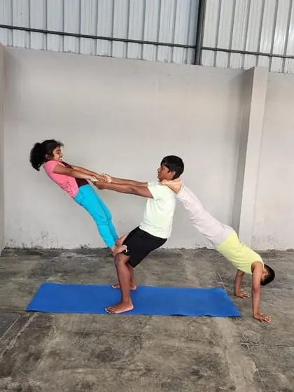 This partner pose is an excellent way to build mutual trust and balance. It strengthens the legs and core of the base, while the supported partner develops stability.