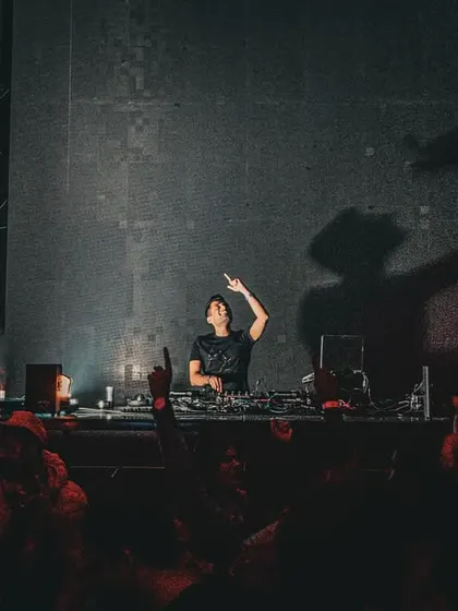 A silhouette shot against the stage lights. Sometimes the most powerful moments are the simplest, with just me, the music, and the crowd's energy.