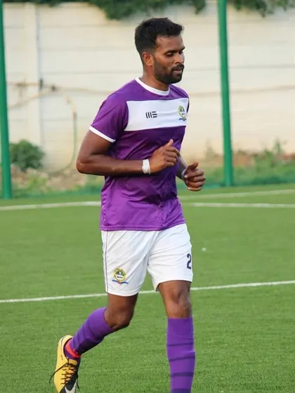 As a player-coach, I lead by example. Here I am on the field, playing in the A Division league.