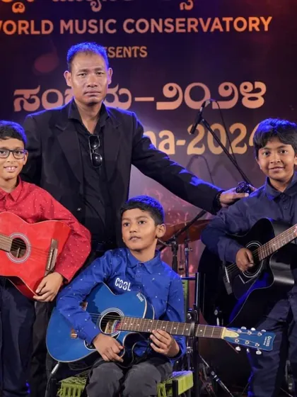 A proud moment for our young guitarists with their teacher, Mr. Along Konyak, after their tribute performance at Kalaa Sangama. We foster a strong bond between our gurus and students.