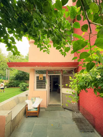 The entrance to a classic Delhi government house, framed by lush greenery. This shot, taken on an iPhone, captures the charming and peaceful side of the city.