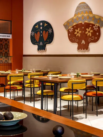 We paid homage to Mexican heritage with bold, artistic statements throughout Tres Amigos. These large, hand-tufted skull rugs, designed in collaboration with Studio Arisaa, reinterpret traditional motifs with vibrant colors, serving as striking focal points against the restaurant's clean walls.