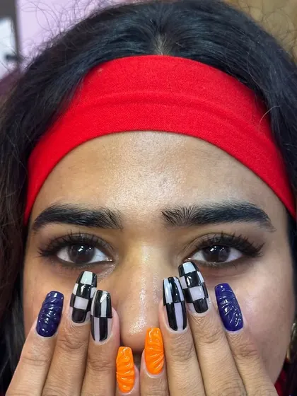A great view of both my lash and nail work. This client is rocking a fresh set of fluffy lash extensions and a bold, graphic nail art design. You can get the full glam experience right here at my studio.