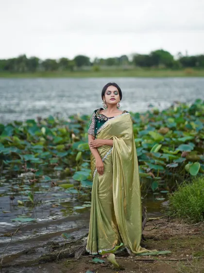 This saree looks stunning against a natural backdrop, making it a great choice for pre-wedding shoots.