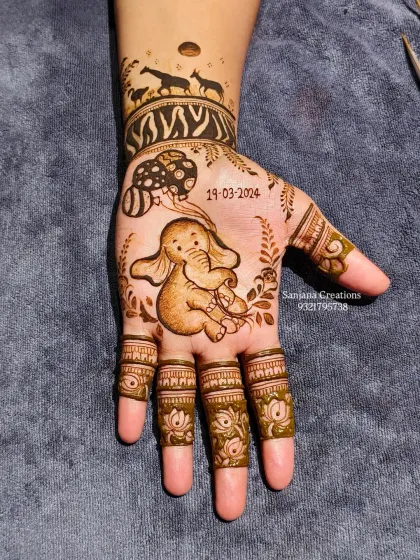 How adorable is this baby elephant? It's the little details and shading that bring these characters to life for a truly unique baby shower mehndi.