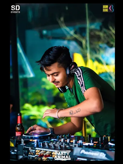 I love the work I do, and I think it shows. This photo captures a moment of pure enjoyment while I'm mixing tracks and watching the crowd's reaction.