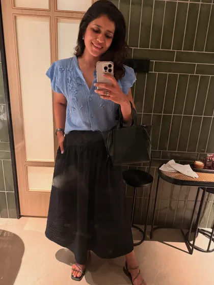 A casual look from my May diary. This embroidered blue top paired with a black skirt is a comfortable and stylish outfit for a day out.