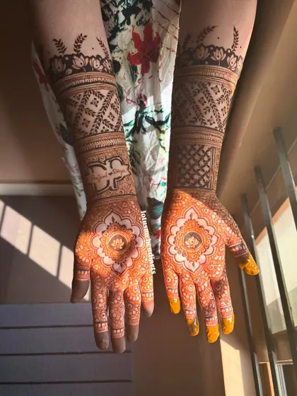 The stain of Dr. Divya's engagement mehendi, a beautiful orange hue that will darken over the next 48 hours.
