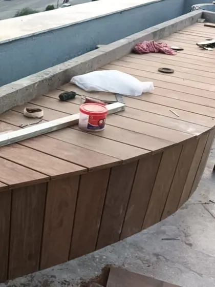 Another view of a custom curved bench under construction. Our team can create bespoke seating solutions that perfectly fit the unique contours of your space.