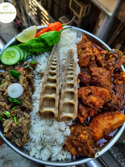 This thali showcases the earthy flavours of the Northeast with bamboo shoot decor, buff curry, and laiwa singju (banana stem salad).