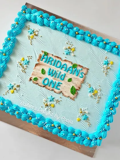 Planning a big celebration? A sheet cake is a great way to ensure every guest gets a slice. This one was designed to match a "Wild One" theme, providing extra servings without compromising on style.