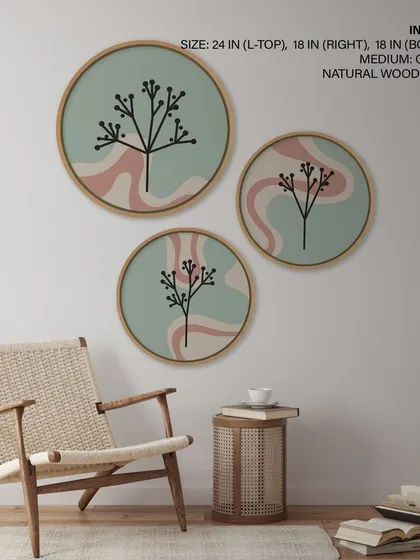 This set of three circular prints features stylized botanical silhouettes against a swirling, abstract background. The combination of organic and graphic elements creates a unique and modern artistic statement.