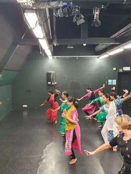 The joy of movement is contagious. Here, participants of all ages and backgrounds share in the energy of a dance workshop.
