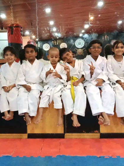 The future of our dojo. A group of my young orange and yellow belt students taking a break after a tough training session.