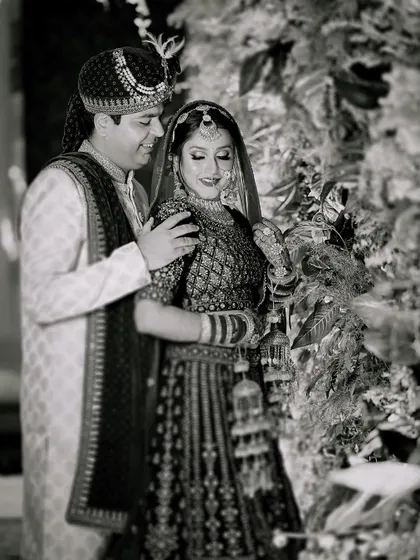 A classic black and white portrait of the couple, highlighting the emotion and connection between them.