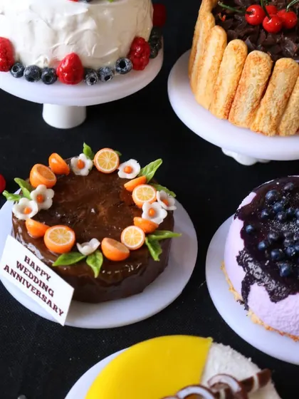 A close-up of the chocolate fruit cake and blueberry cheesecake, showing the beautiful details and textures.