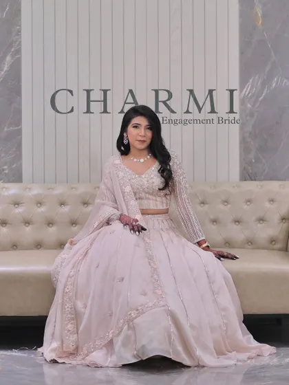 A classic portrait of the engagement bride. The simple, elegant backdrop allows her beautiful outfit and flawless makeup to take center stage.