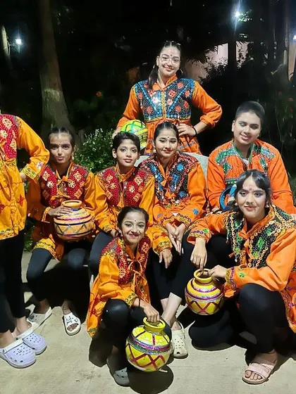 The team that trains together, shines together. Our dance troupe shows off their unity and colorful costumes.