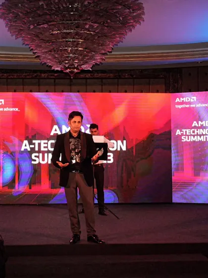 A full-stage view of my performance at the AMD A-Technovation Summit. The large curved LED screen provided a stunning backdrop for my technology-infused illusions.