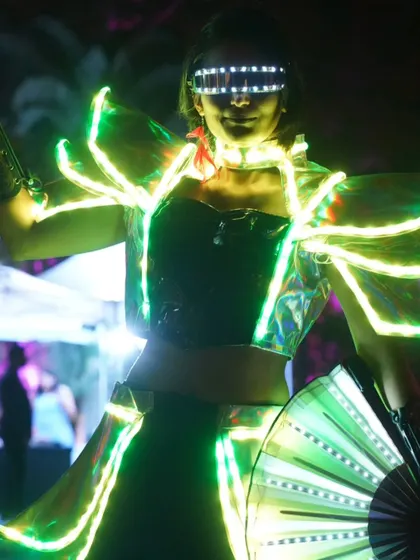 The ultimate LED show costume, complete with a light-up jacket and fan. This outfit is designed to make a huge impact at any party or club night.