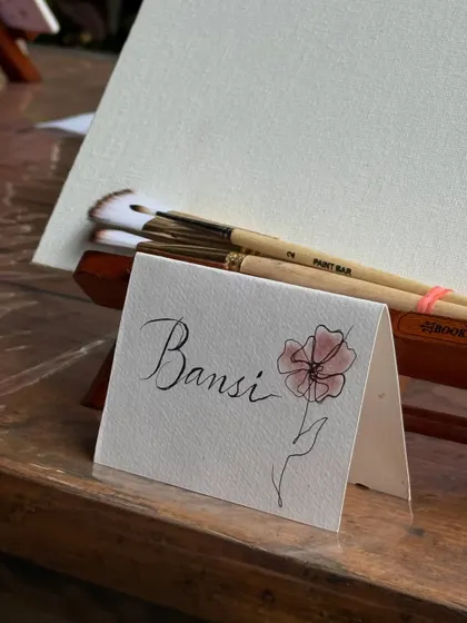 A personalized, hand-painted name card for a guest. It's these little touches that make our experience so special and personal.