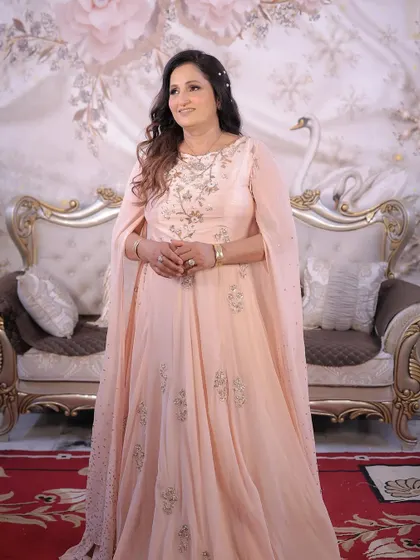 A full-length shot of my mom looking absolutely regal. The soft pink gown and the elegant makeup and hair came together to create a truly special look.