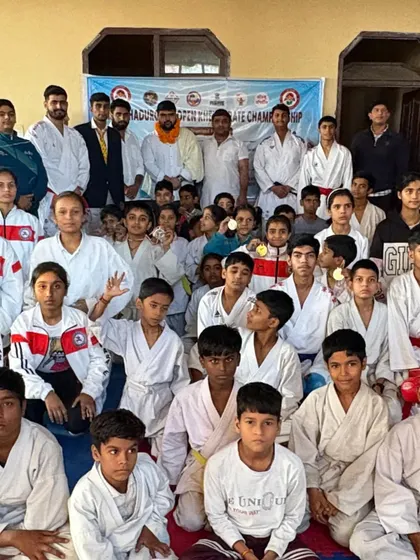 A large group photo of all the participants and winners from a recent championship event.
