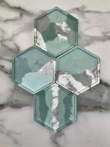 I created these custom hexagonal coasters and a matching tray for a client who wanted green and grey earthy tones. The marbled effect makes each piece unique.