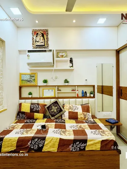 This view shows the sliding wardrobe and the overall simple, clean aesthetic of the bedroom. The focus is on functionality and creating a peaceful environment.