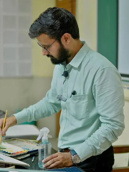 Mixing colors on my palette during the live watercolor workshop at IIT BHU. I always explain my color choices and mixing techniques.