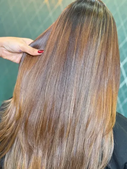 A close-up of a radiant, sunlit, and glossy shade. This image highlights the beautiful blend of tones that create a natural-looking, sun-kissed effect.