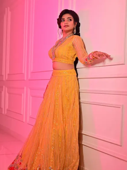 Another angle from the festive wear shoot, showcasing the consistency of the makeup under different poses and lighting. The look remains polished and vibrant, which is crucial for commercial photoshoots.