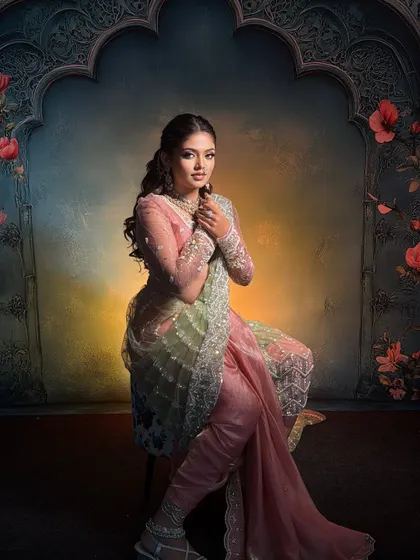 A seated portrait in the 'Menka' Nauvari, showing how the drape looks graceful and comfortable even when sitting.