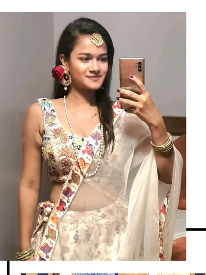 A selfie moment from our client in the white floral lehenga. It's a fun, fresh, and youthful choice for a mehendi or haldi ceremony.
