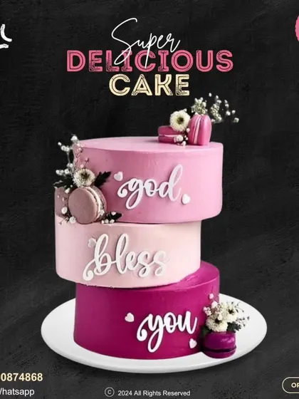 "God Bless You." A stunning three-tier cake in shades of pink and magenta. This beautiful creation is adorned with macarons and delicate flowers, conveying a heartfelt blessing.
