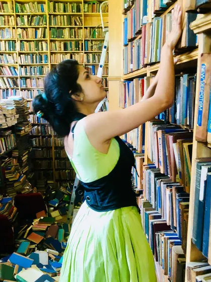 Lost in the aisles of a library. Books are portals to other worlds and other selves, a constant source of inspiration for my writing.