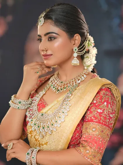 A profile view showcasing the intricate details of the hairstyle, including the traditional hair accessories and fresh jasmine flowers.