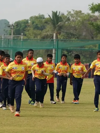 A team jogs together during a warm-up, building fitness and team cohesion before a match.