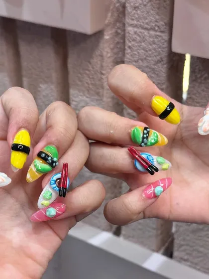 Another angle of the playful and unique sushi nail extensions. This kind of custom 3D work is our specialty and we love bringing your fun ideas to life.