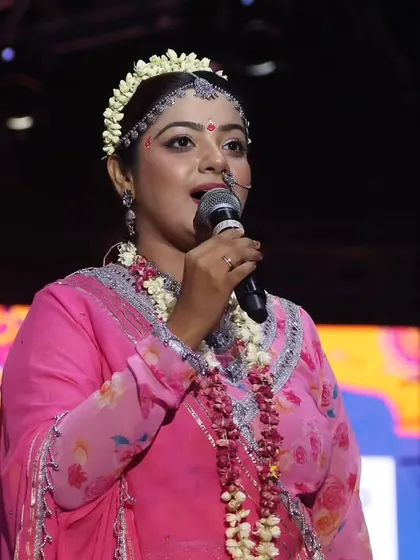A close-up shot from my 'Radha' look on Day 8 of Navratri. As an anchor, I use my voice to guide the audience, and this image captures a moment of serene connection with the crowd.