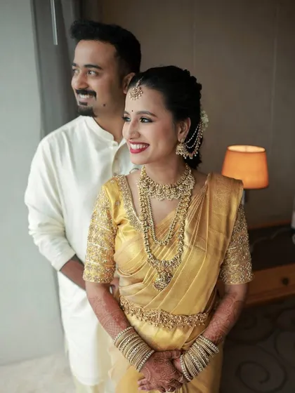 A happy couple portrait. The bride's soft glam makeup complements the groom's simple attire, creating a balanced and beautiful frame.