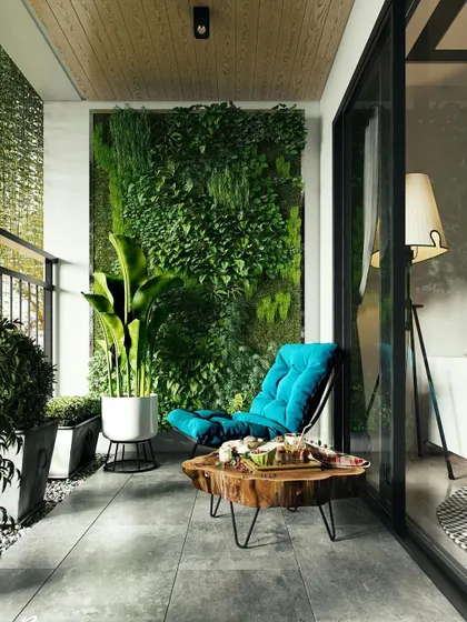 An example of how a simple balcony can become a personal oasis with a vertical garden. This living wall acts as a lush green backdrop, improving air quality and adding a vibrant natural element without taking up floor space. It's paired with a comfortable lounge chair and a rustic wood coffee table to complete the cozy nook.