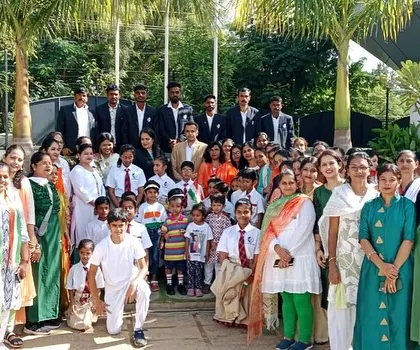 The entire school community, including students, teachers, and support staff, comes together for a group photo on Independence Day.
