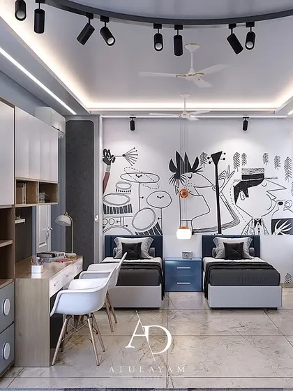 This shared boys' room is designed for creativity, with a cool doodle-art feature wall, individual beds, and a long, shared study desk.